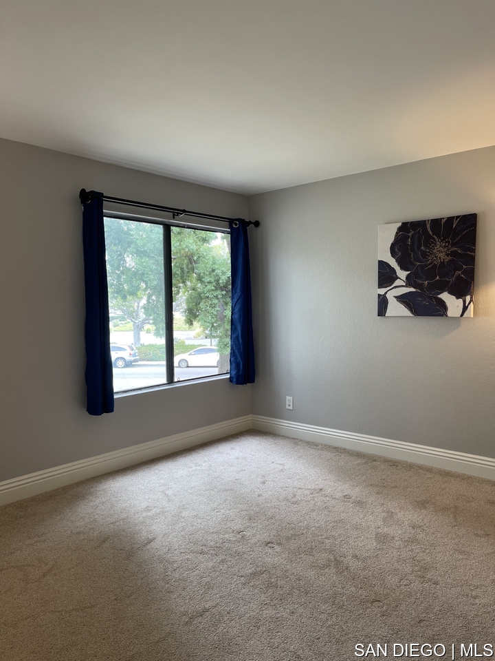 https://sdmls-assets.cdn-connectmls.com/pics/12F08314186F43F9E0636110000A541E/HD_1709668843708_Bedroom_with_full_window_and_wall_to_left_scaled.JPEG