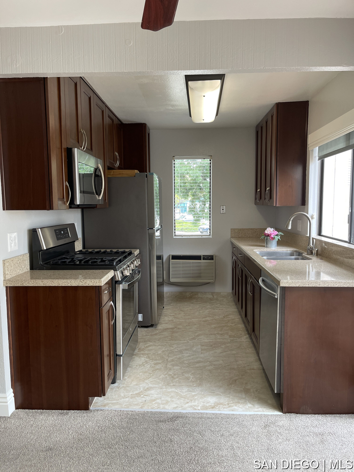 https://sdmls-assets.cdn-connectmls.com/pics/12F08314186F43F9E0636110000A541E/HD_1709668845443_Kitchen_2_4_scaled.JPEG