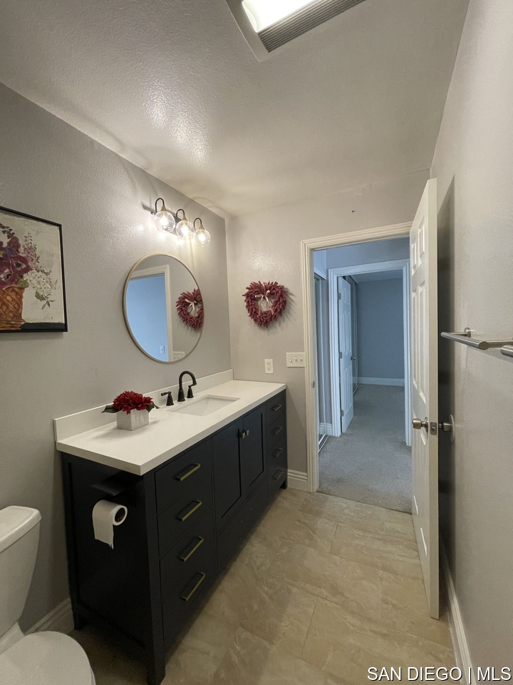 https://sdmls-assets.cdn-connectmls.com/pics/12F08314186F43F9E0636110000A541E/HD_1709668936189_bathroom_2_1_scaled.JPEG