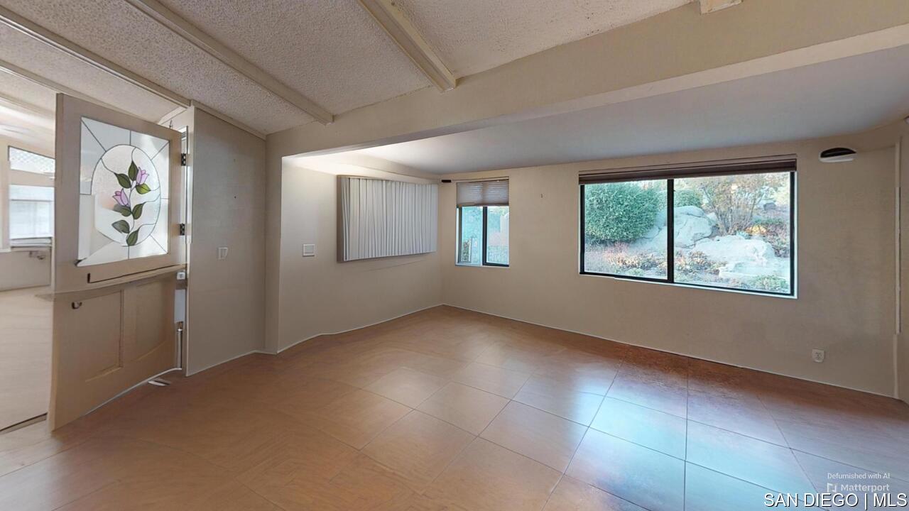 https://sdmls-assets.cdn-connectmls.com/pics/26BC1A71F837C49CE063BE13000AE611/HD_1731455672562_18218_Paradise_Mountain_Rd_SPC195_Valley_Center_CA_92082_Living_Room_2.JPEG