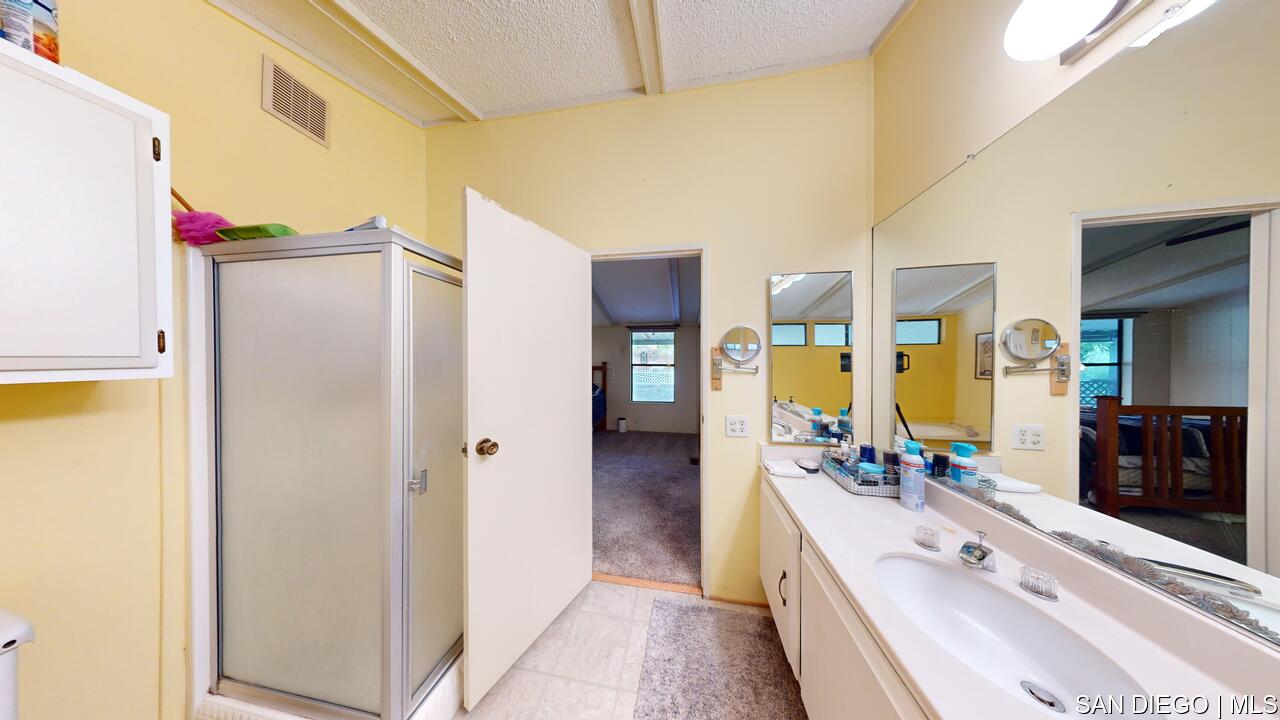 https://sdmls-assets.cdn-connectmls.com/pics/26BC1A71F837C49CE063BE13000AE611/HD_1731455770701_18218_Paradise_Mountain_Rd_SPC195_Valley_Center_CA_92082_11092024_154404.JPEG