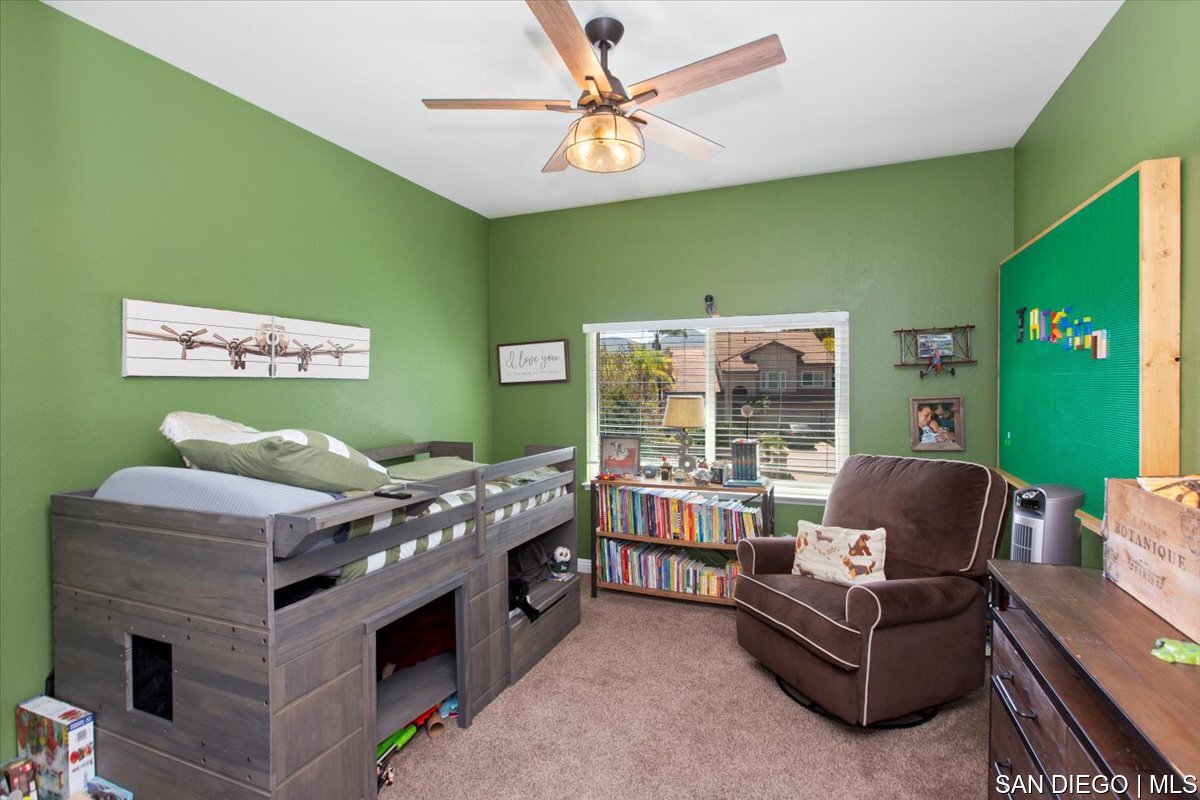 https://sdmls-assets.cdn-connectmls.com/pics/335F04EBBF4A9611E0633111000AF8B3/HD_1745333379354_31_Bedroom.JPEG