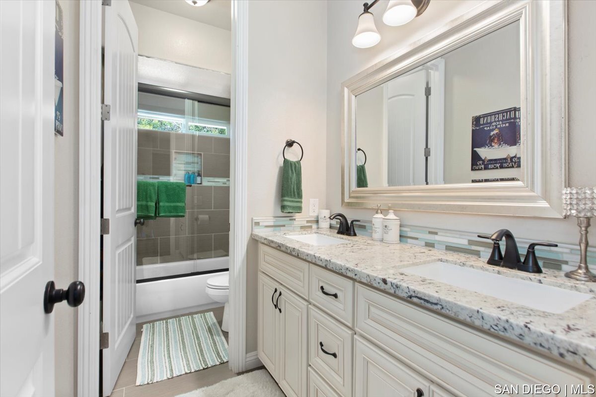https://sdmls-assets.cdn-connectmls.com/pics/335F04EBBF4A9611E0633111000AF8B3/HD_1745333379714_32_Bathroom.JPEG