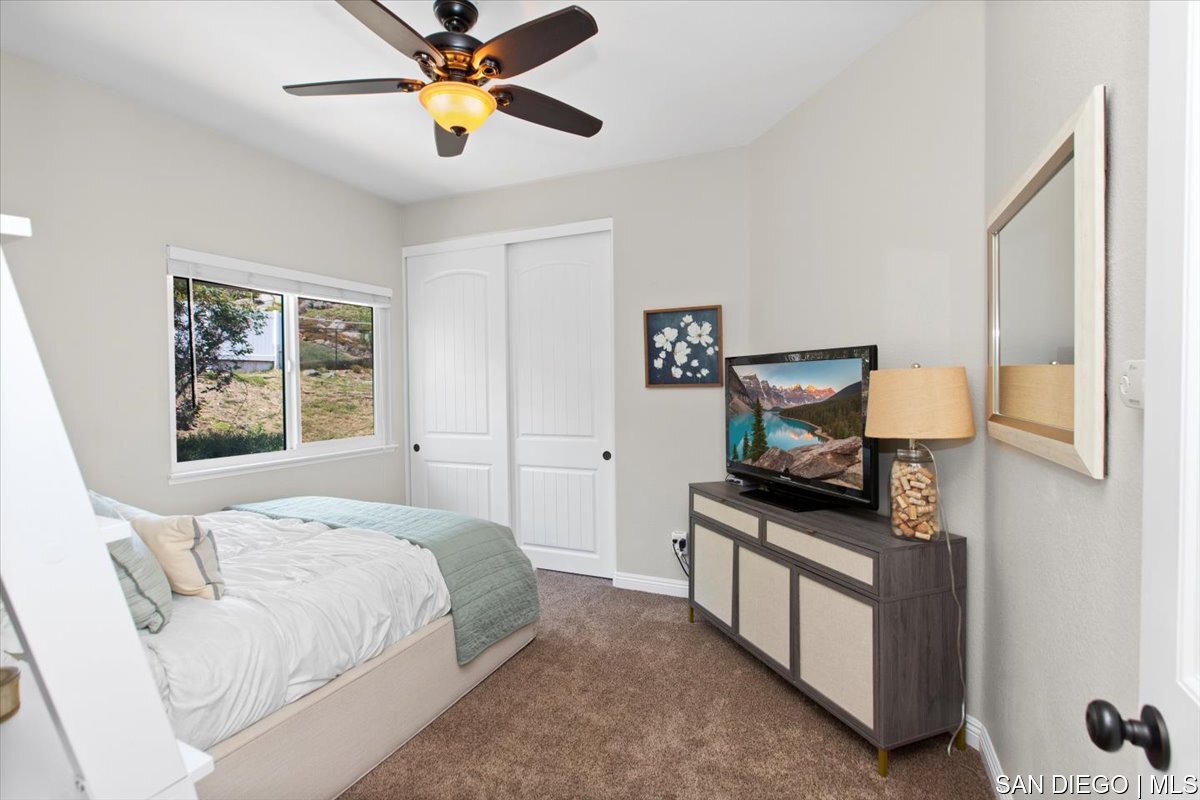 https://sdmls-assets.cdn-connectmls.com/pics/335F04EBBF4A9611E0633111000AF8B3/HD_1745333389757_33_Bedroom.JPEG