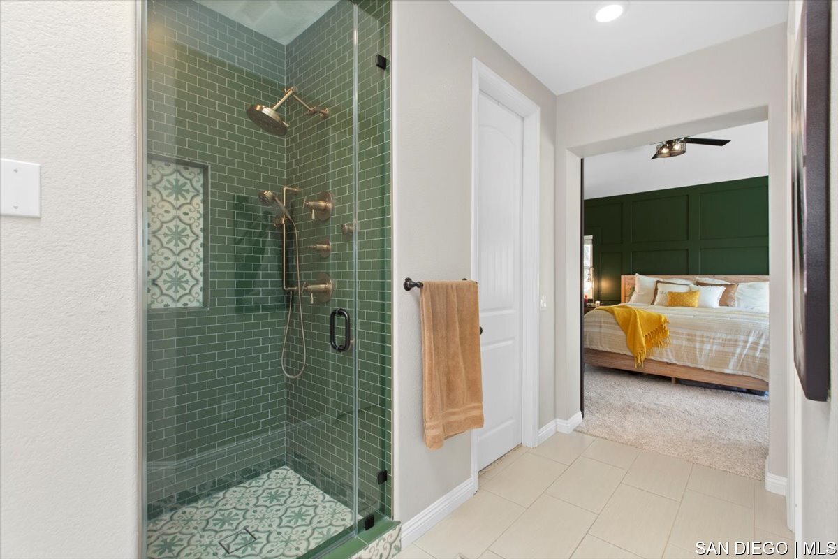https://sdmls-assets.cdn-connectmls.com/pics/335F04EBBF4A9611E0633111000AF8B3/HD_1745333399526_41_Custom_Shower.JPEG