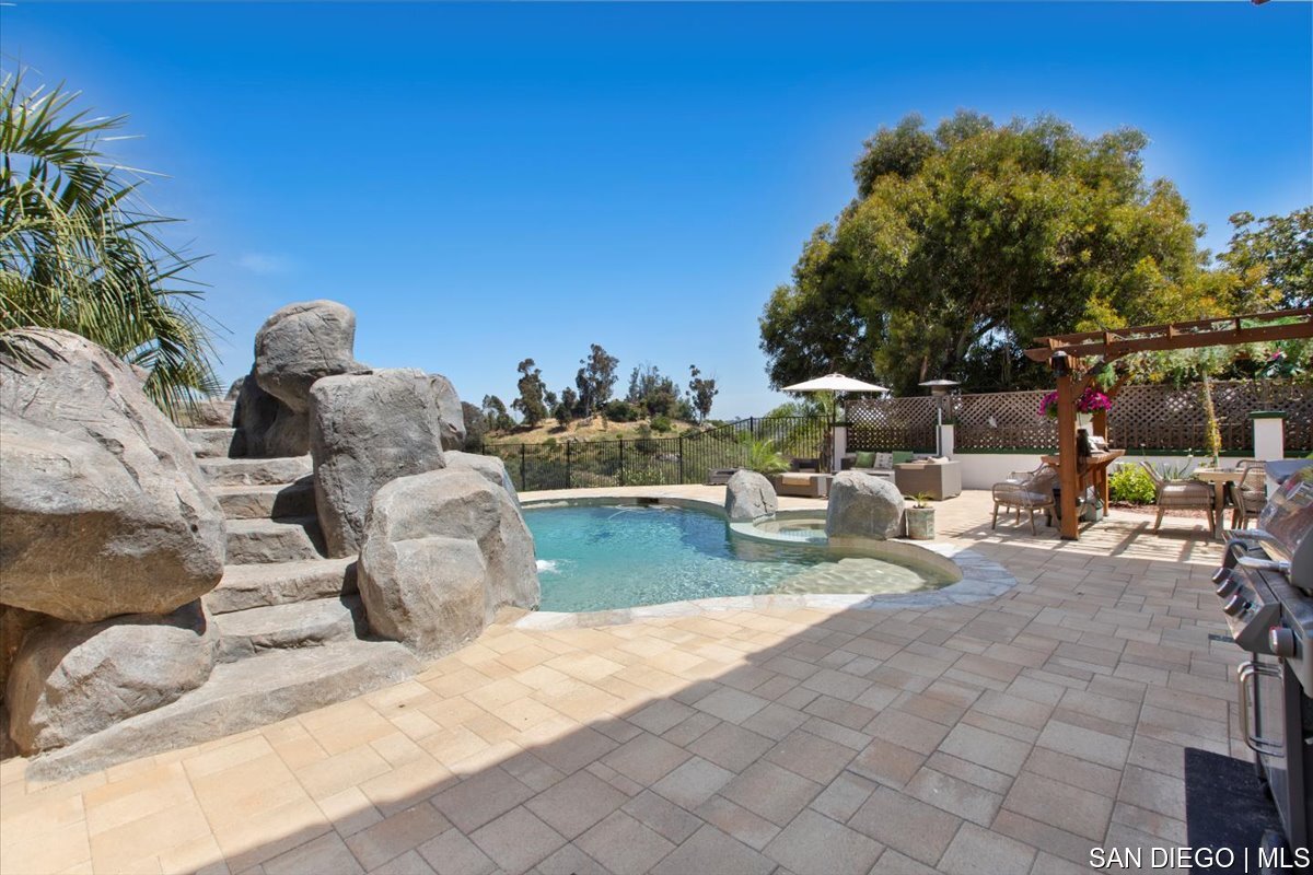 https://sdmls-assets.cdn-connectmls.com/pics/335F04EBBF4A9611E0633111000AF8B3/HD_1745333399896_43_Backyard.JPEG