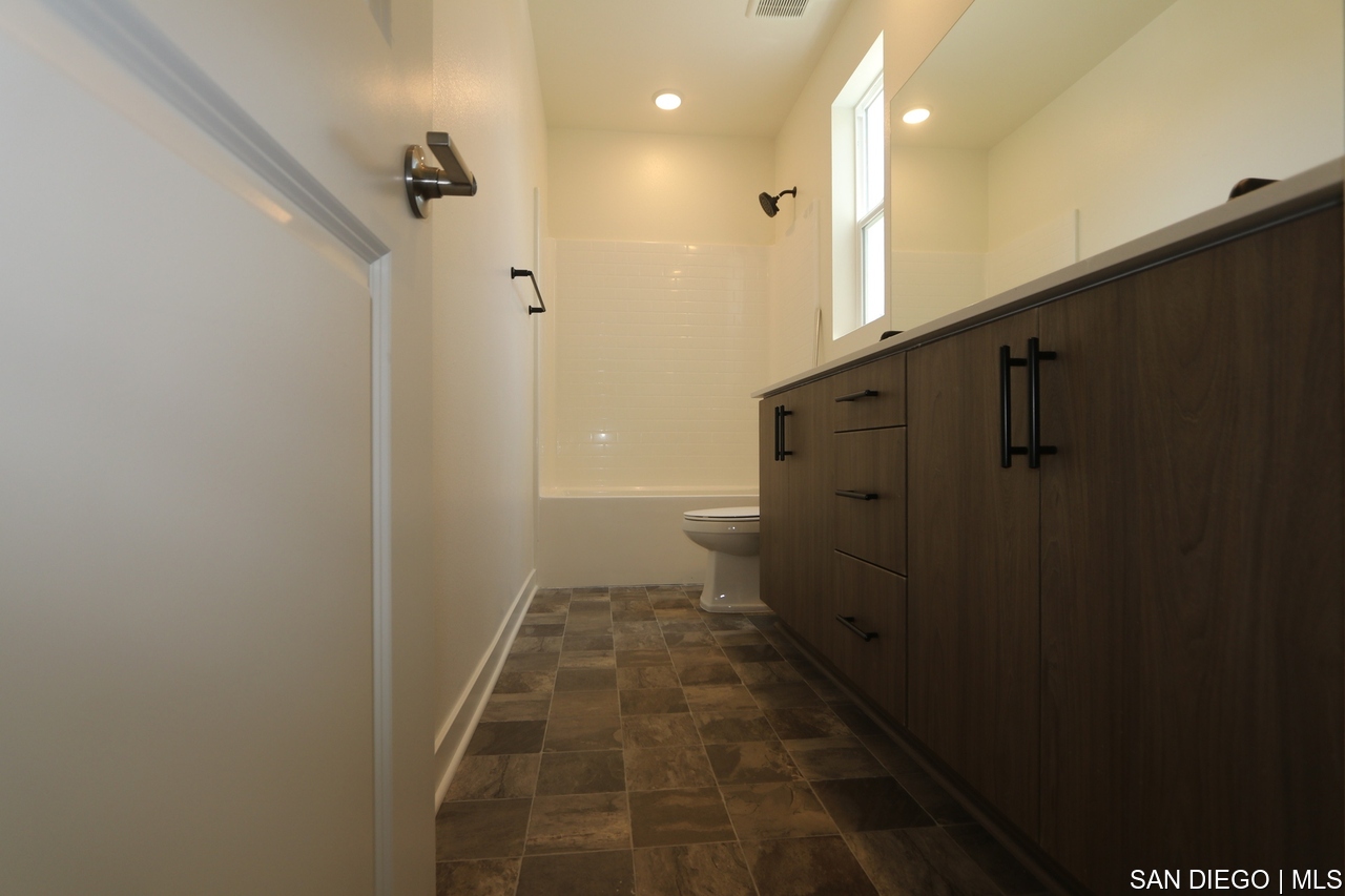 https://sdmls-assets.cdn-connectmls.com/pics/399E1EC4F628488EE0636E11000A3FED/HD_1752205842409_Pomelo_632MEADOWOODST_I.Finish_none56.JPEG