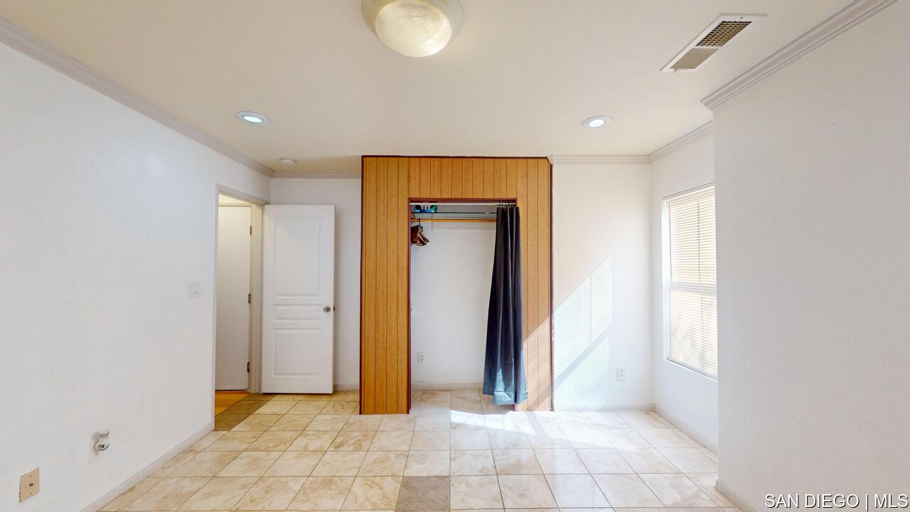 https://sdmls-assets.cdn-connectmls.com/pics/3C1F02DA71EAF82EE0639F13000AECE5/HD_1755009547243_1876_E_12th_St_National_City_CA_91950_07312025_174433.JPEG