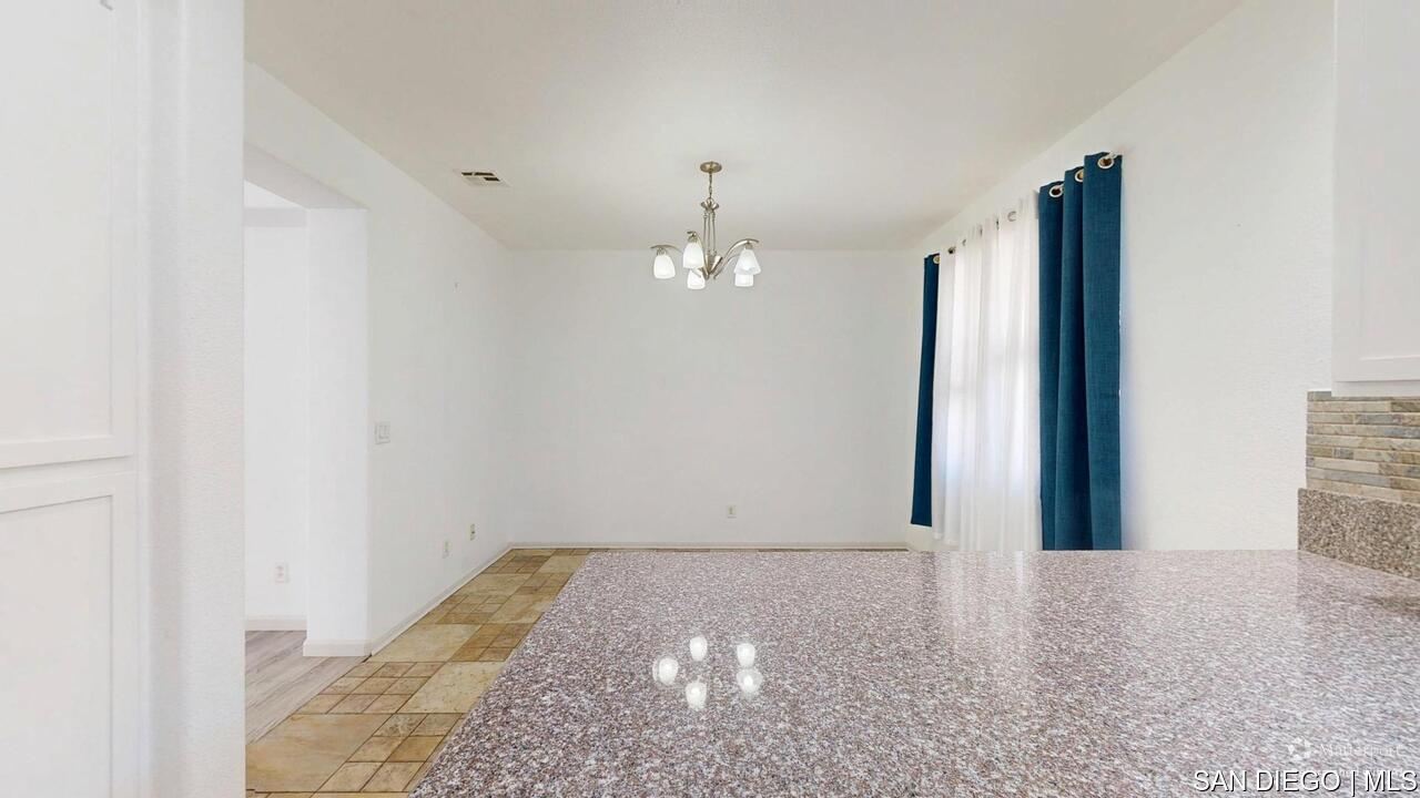https://sdmls-assets.cdn-connectmls.com/pics/3C1F02DA71EAF82EE0639F13000AECE5/HD_1755009552580_1876_E_12th_St_National_City_CA_91950_07312025_174801_defurnished.JPEG